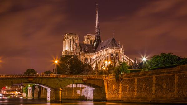 Free notre dame de paris with background of clouds during nighttime hd travel wallpaper download