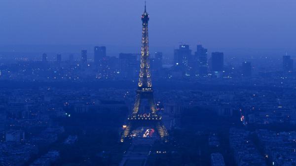 Free paris eiffel tower and cityscape during evening with fog hd travel wallpaper download