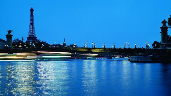 Free paris eiffel tower blue water in front and blue sky background hd travel wallpaper download