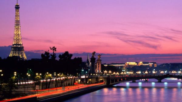 Free paris eiffel tower on side with purple sky background hd travel wallpaper download