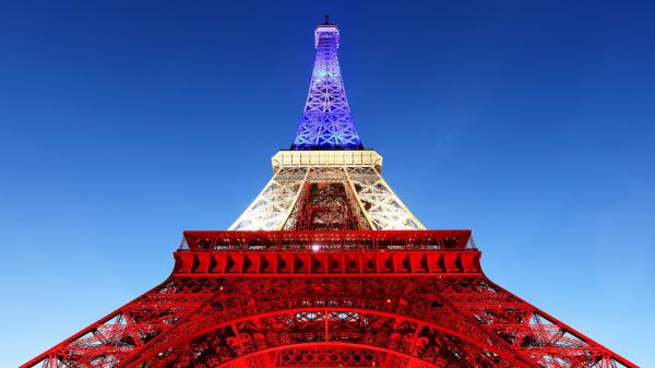 Free paris eiffel tower with blue white and red lights upward view with blue sky background hd travel wallpaper download