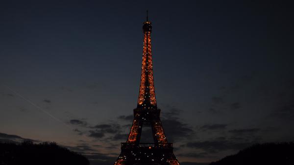 Free paris eiffel tower with red lights with background of dark sky 4k hd travel wallpaper download