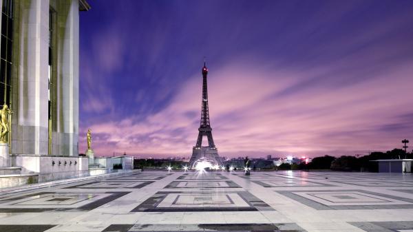 Free paris eiffel tower with shallow background of purple cloudy sky hd travel wallpaper download