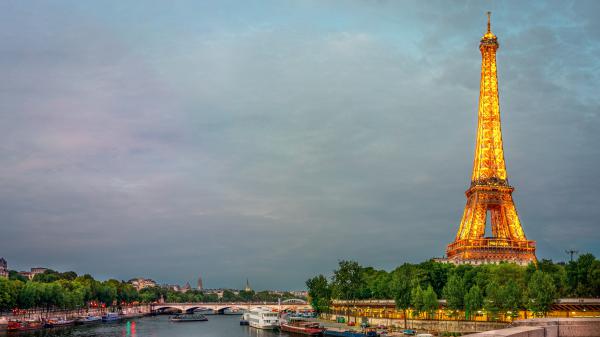 Free paris eiffel tower yellow lights on side with blue sky and clouds background 4k 8k hd travel wallpaper download