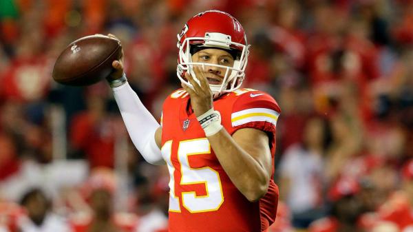 Free patrick mahomes is having sprint football in hand wearing red sports dress in blur audience background hd sports hd wallpaper download