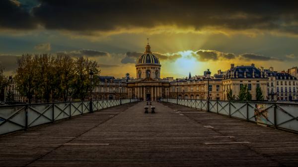 Free pedestrian bridge and institut de france paris with background of sunbeam and cloudy sky 4k 5k hd travel wallpaper download