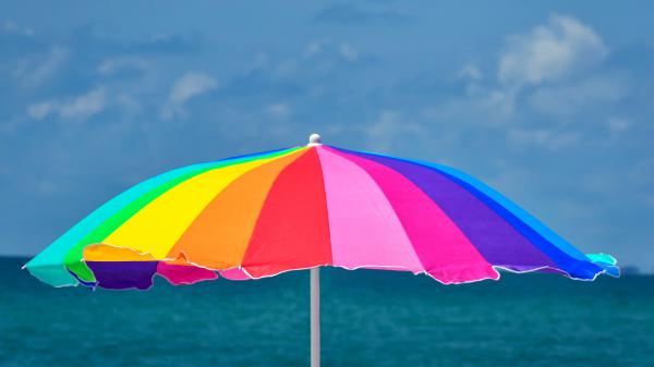 Free rainbow umbrella at beach 5k wallpaper download