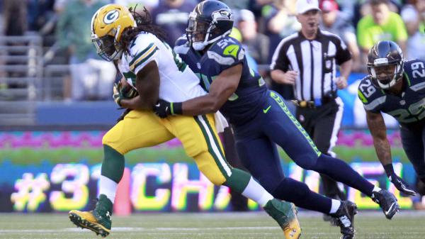 Free seattle seahawks is defencing ball from another player hd seattle seahawks wallpaper download