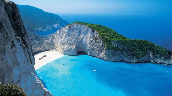 free shipwreck on beach sand and white green covered mountain hd beach wallpaper download