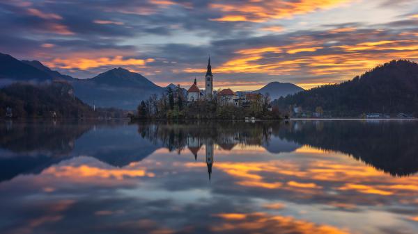 Free slovenia assumption of mary church near mountain reflection on lake during evening hd travel wallpaper download