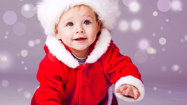 Free smiley cute baby boy is crawling on floor wearing santa dress in bubbles background hd cute wallpaper download
