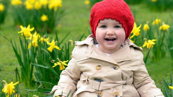 Free smiley cute little girl is wearing brown dress and woolen knitted cap on head hd cute wallpaper download
