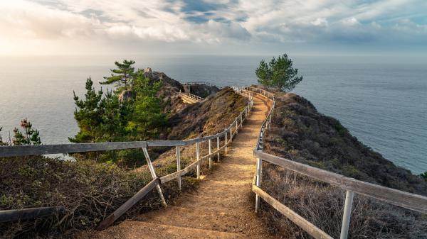 Free stairs with fence on mountan heading to seashore hd travel wallpaper download