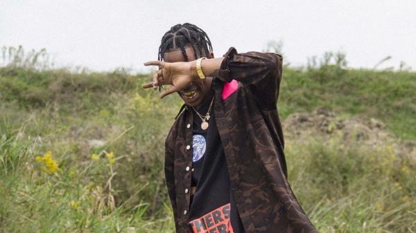 Free travis scott is closing eyes with hand wearing brown and black dress gold chains on neck hd travis scott wallpaper download