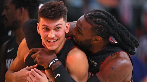 Free tyler herro is hugging from behind another player wearing black dress basketball hd sports wallpaper download