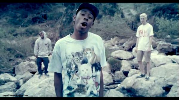 Free tyler the creator is standing on rock wearing cats printed tshirt with wide open mouth hd music wallpaper download