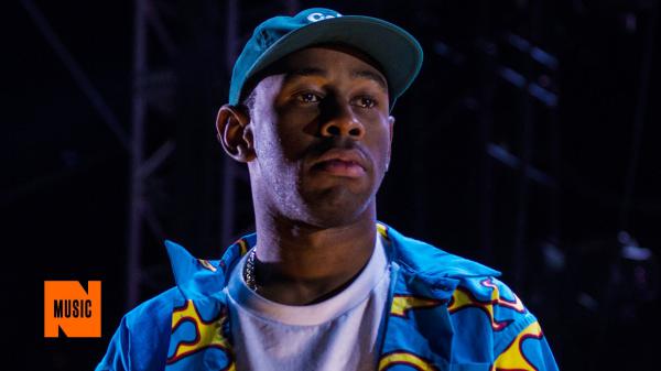 Free tyler the creator is wearing blue shirt and cap looking side in a black background hd music wallpaper download