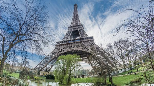 Free upward view of paris eiffel tower with background of sky and clouds hd travel wallpaper download