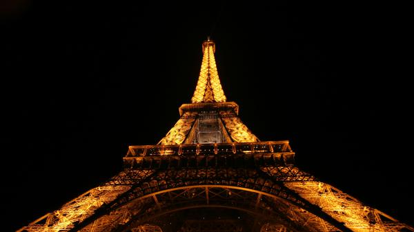 Free upward view of yellow lighting paris eiffel tower with black sky background during night time 4k hd travel wallpaper download