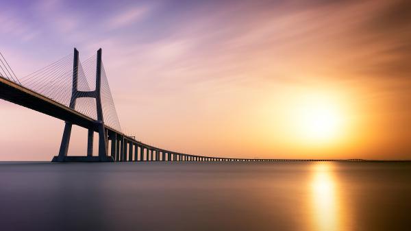 Free vasco da gama bridge sunset portugal 4k 5k wallpaper download