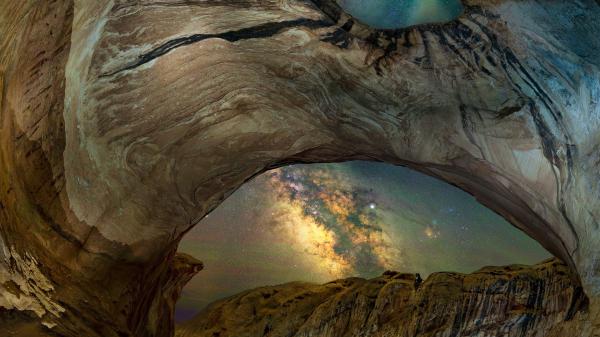 Free view of milky way stars between mountain arch cave hd travel wallpaper download