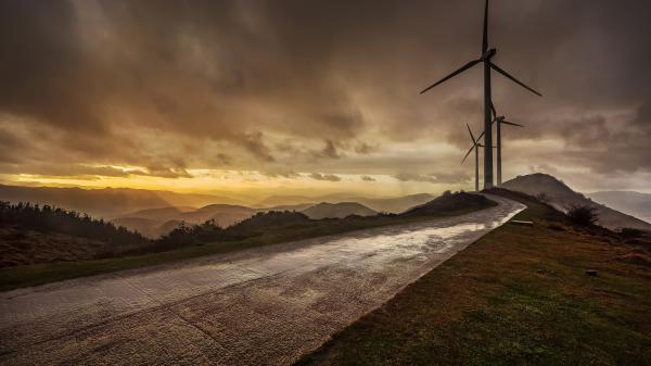 Free wind turbine under dirty cloudy sky hd travel wallpaper download